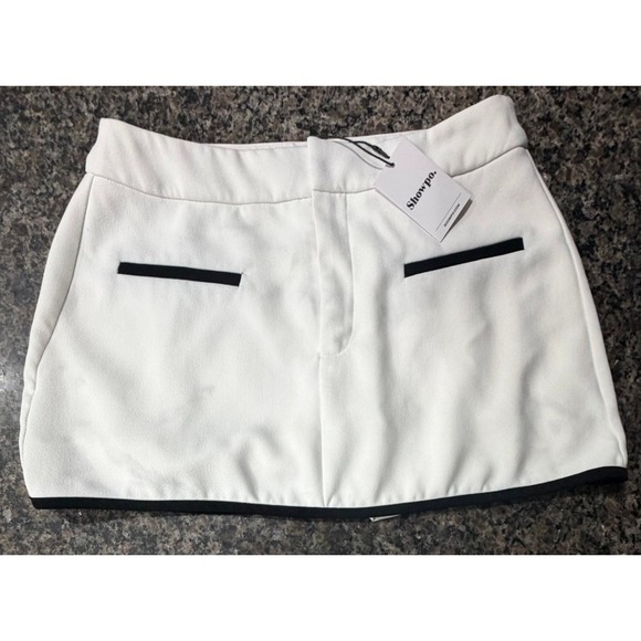 Showpo. Pants - Showpo White Mini Skort Black Trim Faux Pockets Size US 10 NWT